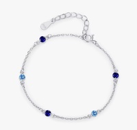 Ocean Dots — stříbrný náramek s modrými krystalky